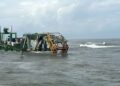 Navy Rescues 59 from Stranded Dredging Vessel, Officer Dies