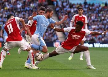 Stones Strikes Late as Manchester City Salvage 2-2 Draw Against 10-Man Arsenal