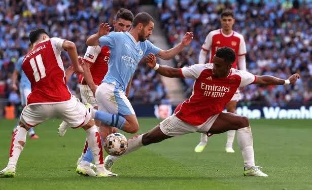 Stones Strikes Late as Manchester City Salvage 2-2 Draw Against 10-Man Arsenal