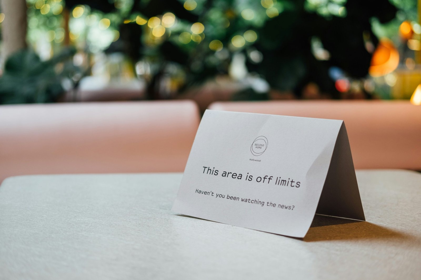 Convert the subjects to black and white high contrast monochrome, keep their exact positions and poses, change the background to solid bold red, editorial magazine style, dramatic lighting, deep shadows