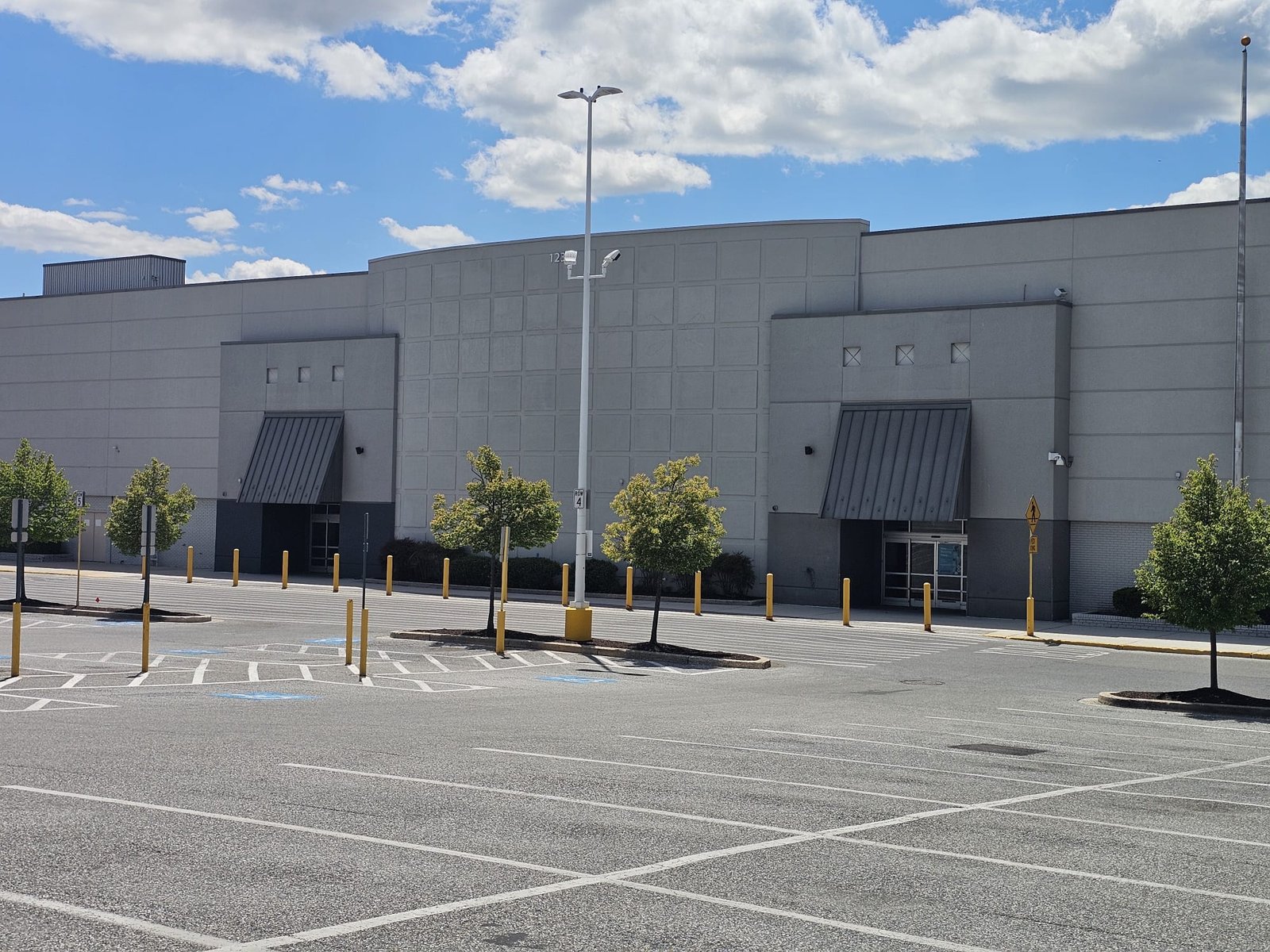 Empty parking lot of the now-abandoned Walmart located at Putting Hill